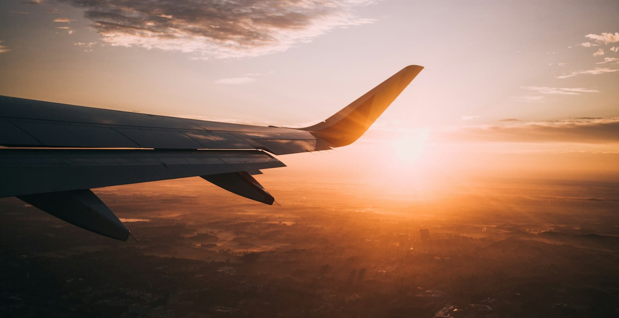 airplane on sky during golden hour